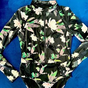 Une Piece size 10 woman’s black floral one piece long sleeve swimming suit